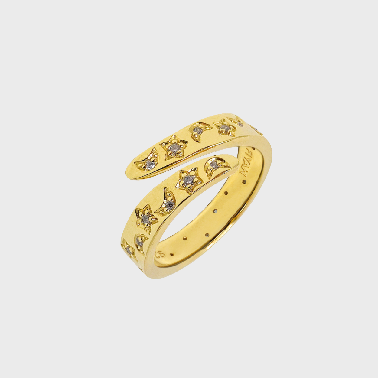 Gold plated ring with gemstone accents in moon and star shapes